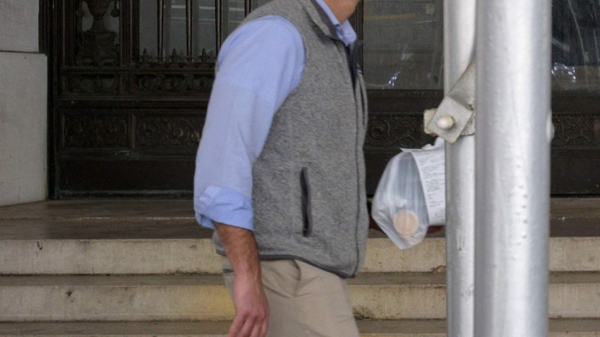 A man walks outside the New York Stock Exchange