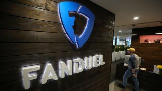 A sign hangs on the wall in the reception area at Fanduel Inc.’s offices in Edinburgh, U.K., on Tuesday, Feb. 7, 2017. 