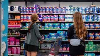 A family shops for women’s hygiene products at a Walmart Supercenter on July 22, 2024 in Austin, Texas.