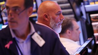 Traders work on the floor of the New York Stock Exchange during afternoon trading on August 02, 2024 in New York City. 