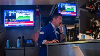 Traders work on the floor of the New York Stock Exchange (NYSE) on August 05, 2024, in New York City.