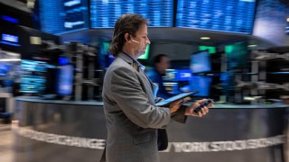 Traders work the floor of the New York Stock Exchange on August 16, 2024. 