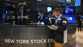 Traders work on the floor of the New York Stock Exchange (NYSE) during morning trading in New York on August 23, 2024. 