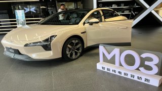 Chinese electric car company Xpeng displays its mass-market Mona M03 coupe inside a headquarters’ showroom in Guangzhou, China, on Aug. 26, 2024.