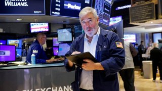 Traders work on the floor at the New York Stock Exchange (NYSE) in New York City, U.S., August 28, 2024. 