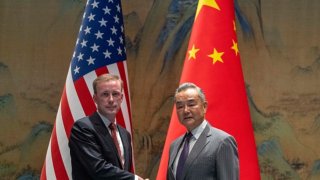 China’s Foreign Minister Wang Yi (R) shakes hands with US National Security Advisor Jake Sullivan at Yanqi Lake in Beijing on August 27, 2024. 