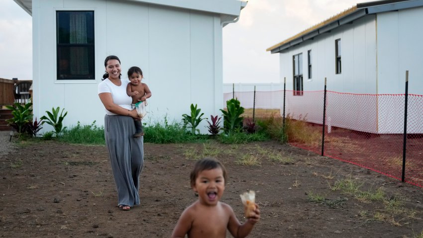 The family has moved multiple times over the past 11 months after being displaced by the 2023 wildfire and is the first to move into the modular home community being built for those affected. July 10, 2024, in Kahului, Hawaii.