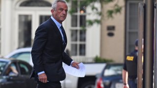 Independent presidential candidate Robert F. Kennedy Jr., right, arrives at the Albany County Courthouse to fight a lawsuit he falsely claimed to live in New York state, Wednesday, Aug. 7, 2024, in Albany, N.Y.