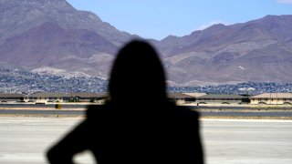 FILE – Vice President Kamala Harris stands in front of mountains during a news conference, June 25, 2021, at the airport after her tour of the U.S. Customs and Border Protection Central Processing Center in El Paso, Texas.