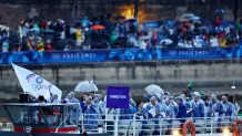 PARIS, FRANCE - JULY 26: Athletes of Taiwan aboard a boat in the floating parade on the river Seine during the Opening Ceremony of the Olympic Games Paris 2024 on July 26, 2024 in Paris, France. (Photo by Esa Alexander-Pool/Getty Images)