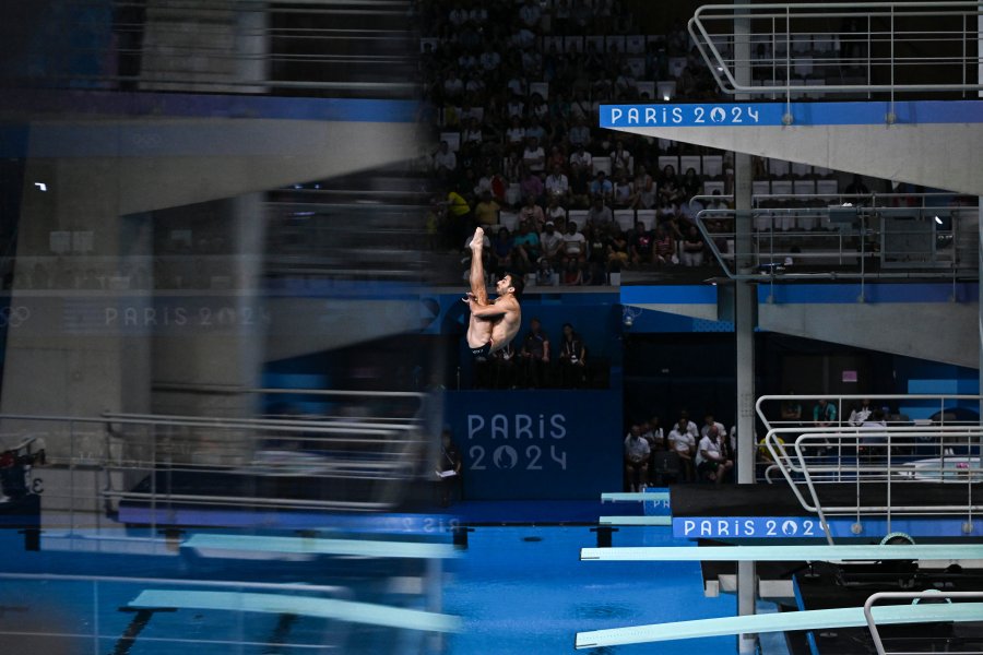 Italy's Giovanni Tocci competes in the men's 3m springboard diving preliminary during the Paris 2024 Olympic Games at the Aquatics Centre in Saint-Denis, north of Paris, on August 6, 2024