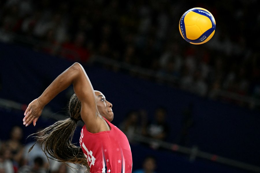 Chiaka Ogbogu spikes the ball during the volleyball women's quarter-final match