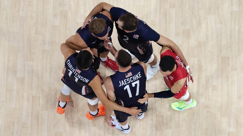 PARIS, FRANCE – AUGUST 07: (EDITORS NOTE: Image was captured using a robotic camera positioned above the field of play.) Team United States athletes huddle during a Men’s Semifinals match against Team Poland on day twelve of the Olympic Games Paris 2024 at Paris Arena on August 07, 2024 in Paris, France. (Photo by Matthew Stockman/Getty Images)