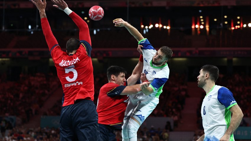 Slovenia’s left back #88 Aleks Vlah (2ndR) shoots past Spain’s pivot #20 Abel Serdio (2ndL) during the men’s bronze medal handball match between Spain vs Slovenia of the Paris 2024 Olympic Games, at the Pierre-Mauroy stadium in Villeneuve-d’Ascq, northern France, on August 11, 2024. (Photo by SAMEER AL-DOUMY/AFP via Getty Images)