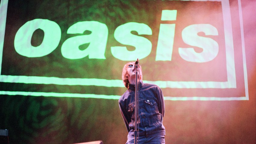 Liam Gallagher of Oasis, music group, performing on stage, Balloch Castle Country Park Balloch, Loch Lomond, in West Dunbartonshire, Scotland, 4th August 1996. (Photo by Runnacles/Gunion/Mirrorpix/Getty Images)