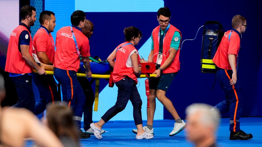 Medical team carries Tamara Potocka away on a stretcher