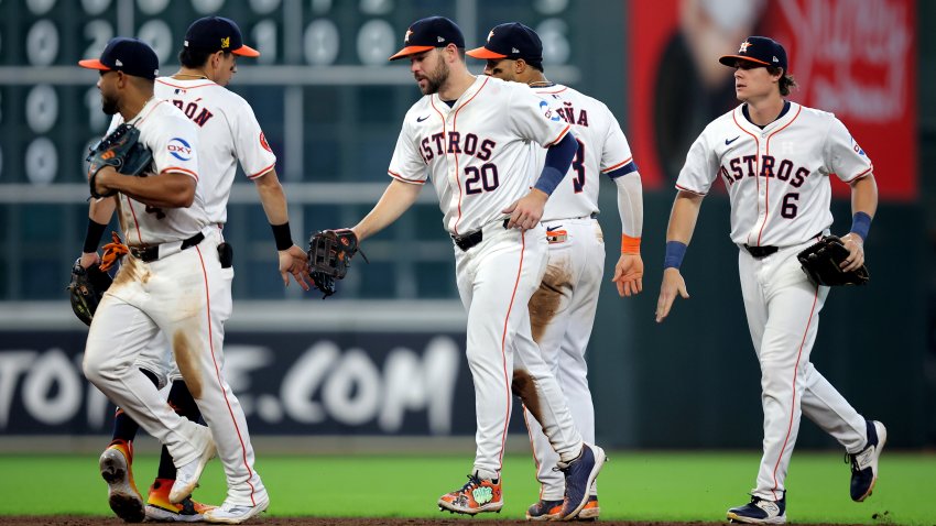 Aug 18, 2024; Houston, Texas, USA; Houston Astros players congratulate each other after the final out against the Chicago White Sox during the ninth inning at Minute Maid Park. Mandatory Credit: Erik Williams-USA TODAY Sports