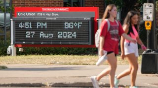 Temperatures in the mid-90s are displayed on the digital thermometer outside the Ohio Union on the campus of Ohio State University on Aug. 27, 2024.