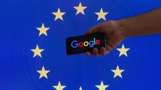 The European Union flag is seen with Google’s logo.