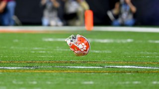 A Clemson Tigers helmet on the field of last season’s College Football Playoff National Championship Game. Clemson is among the NCAA Division I major conference programs to recently have football players test positive for Covid-19, adding more uncertainty to the planned start of college football season.