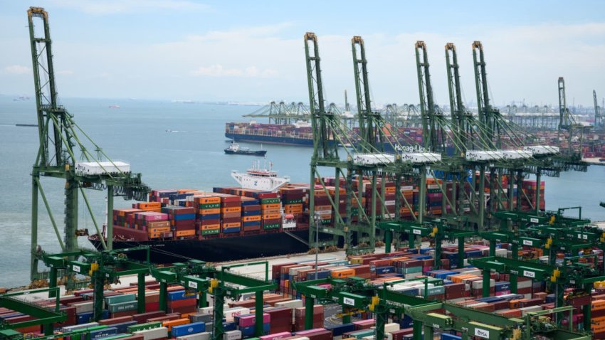 Containers are loaded on the premises of the port operator PSA, the Port of Singapore Authority (PSA), at the Port of Singapore on 14 June 2022.