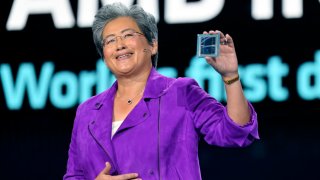 Lisa Su displays an AMD Instinct MI300 chip as she delivers a keynote address at CES 2023 in Las Vegas, Nevada, on Jan. 4, 2023.