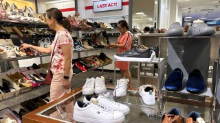 People shop for shoes in a store at The Village at Corte Madera on May 30, 2024 in Corte Madera, California. 