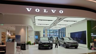 A worker at a Volvo car store introduces the Volvo xc60 and other models via a live streaming in Shanghai, China, March 18, 2024.