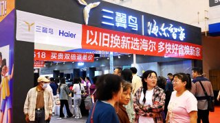 A banner plays up China’s trade-in policy at a home goods expo in Qingdao, Shandong province, China, on June 1, 2024.