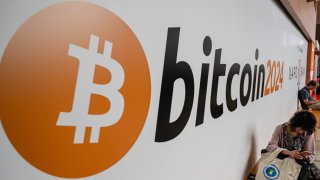 A bitcoin sign is seen in the main hall during the Bitcoin 2024 conference at Music City Center July 26, 2024 in Nashville, Tennessee.