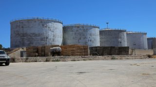 Crude oil storage tanks are seen at Azzawiya oil refinery, in Zawiyah, west of Tripoli, Libya July 23, 2020. 