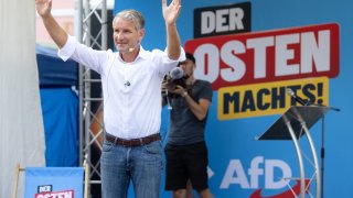 13 August 2024, Thuringia, Suhl: Björn Höcke (AfD), state parliamentary group and party leader as well as his party’s top candidate, speaks at the AfD Thuringia election campaign on the market square in front of the slogan “Der Osten macht’s”.