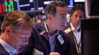 Traders work on the floor of the New York Stock Exchange during morning trading on September 04, 2024 in New York City. 