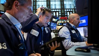 Traders work on the floor at the New York Stock Exchange on Sept. 4, 2024.