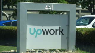 Close-up of sign at entrance to Silicon Valley headquarters of outsourcing and freelancing company Upwork, Mountain View, California, May 3, 2019. 