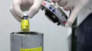 An employee works at the  NSA radiopharmaceutical plant in Aedea Rome, Italy. 