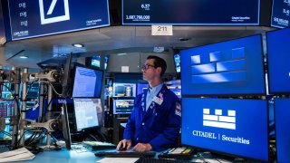 Traders work on the floor of the NYSE. 