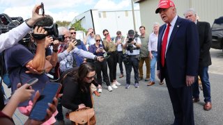 Republican presidential nominee, former U.S. President Donald Trump gives brief statements as he arrives at Valdosta Regional Airport to visit areas affected by Hurricane Helene on September 30, 2024 in Valdosta, Georgia.