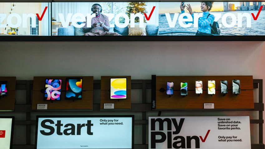 Phones and tablets inside a Verizon store in New York, US, on Friday, Jan. 12, 2024. Verizon Communications Inc. is scheduled to release earnings figures on January 23. Photographer: Angus Mordant/Bloomberg via Getty Images