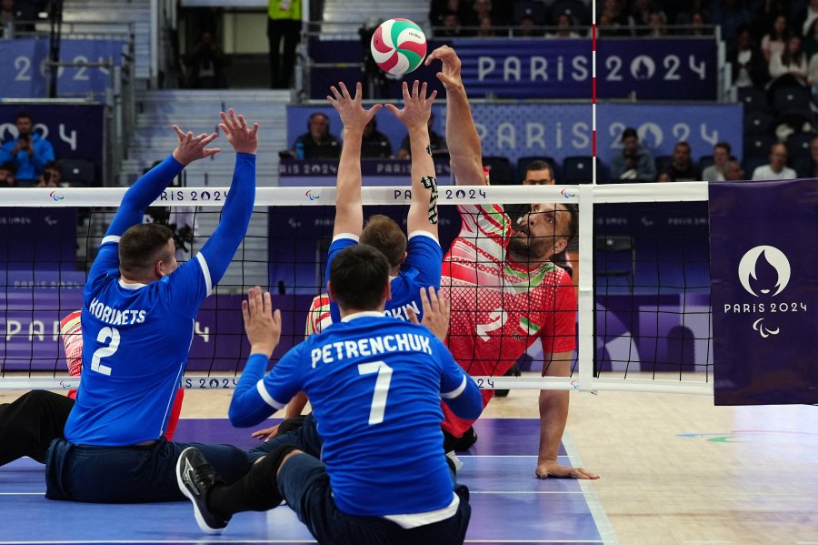 Iran's #2 Morteza Mehrzadselakjani competes during the sitting volleyball men's preliminary round pool B match between Iran and Ukraine during the Paris 2024 Paralympic Games at the North Paris Arena in Paris on August 30 2024