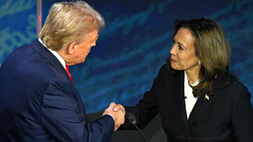 US Vice President and Democratic presidential candidate Kamala Harris (R) shakes hands with former US President and Republican presidential candidate Donald Trump during a presidential debate at the National Constitution Center in Philadelphia, Pennsylvania, on September 10, 2024. (Photo by SAUL LOEB / AFP) (Photo by SAUL LOEB/AFP via Getty Images)