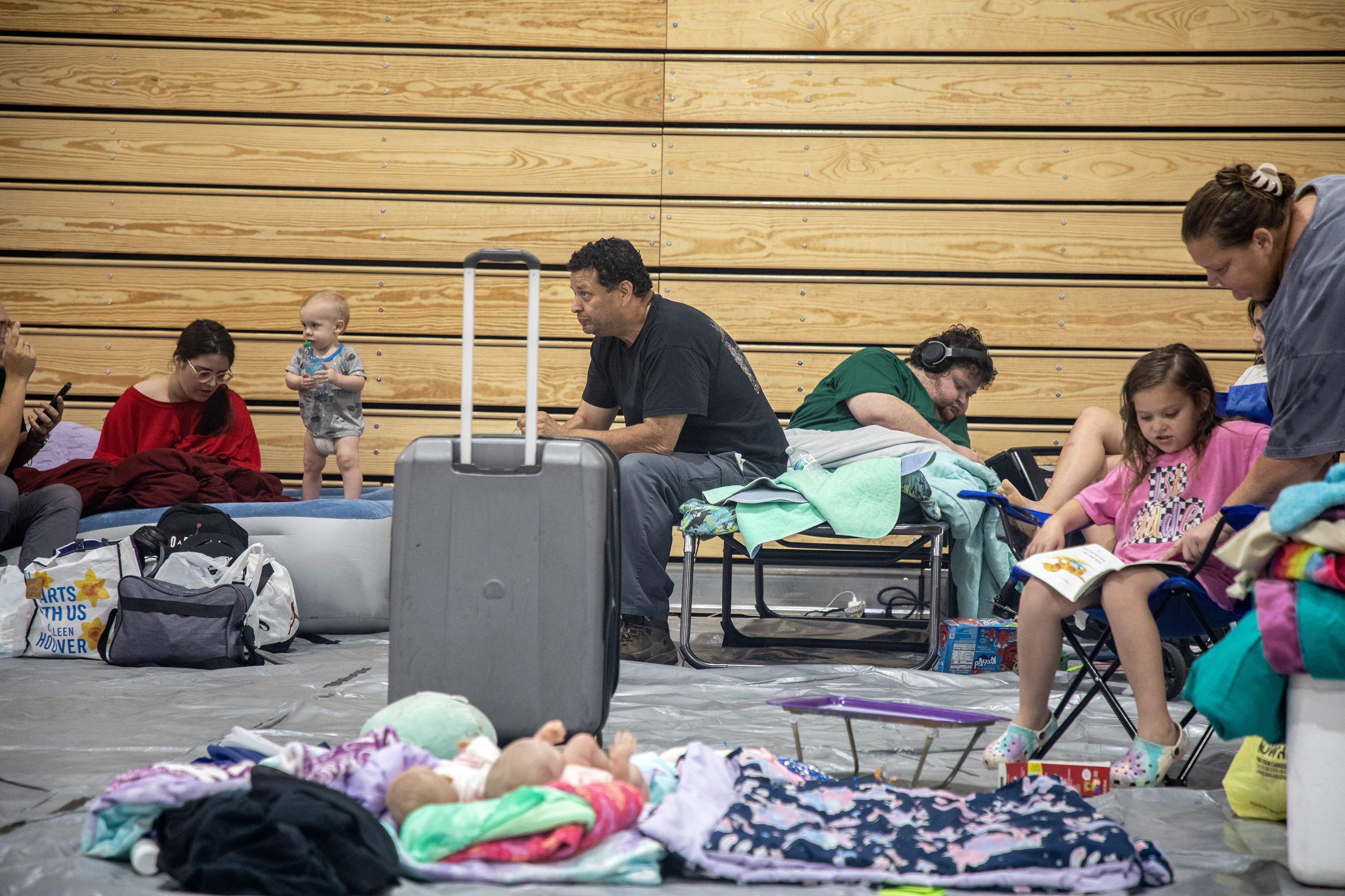 Marlon Ng, center, evacuated his family to a shelter at Leon High School in Tallahassee, FL, on Thursday, September 26, 2024, in preparation for a fast-approaching Hurricane Helene.