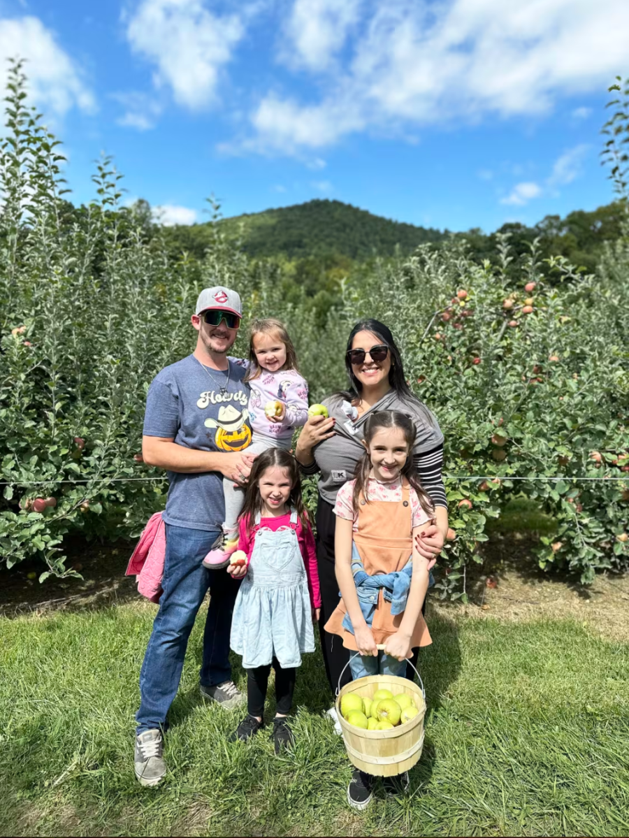 A family at an apple orchard