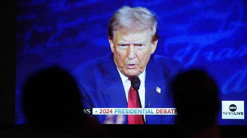 Donald Trump is shown on screen during a debate watch party in Fayetteville, North Carolina, Sept. 10, 2024.