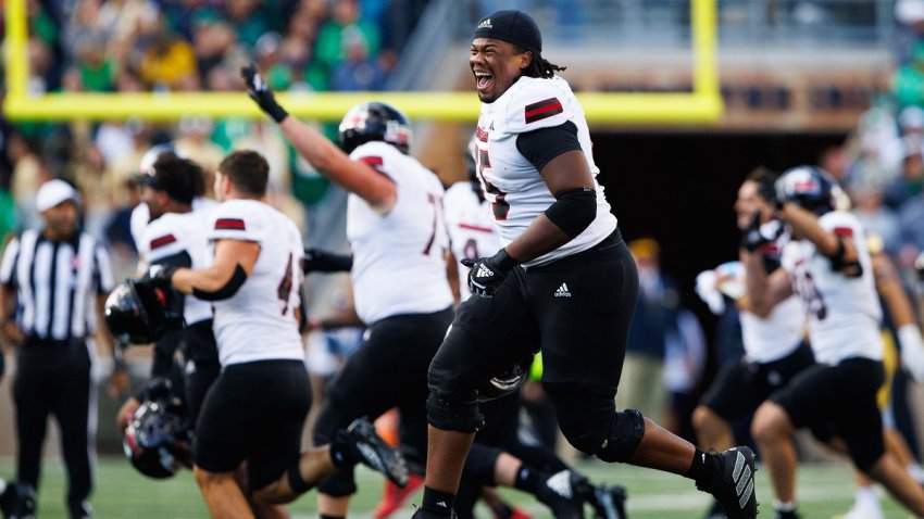 Northern Illinois offensive lineman Abiathar Curry jumps in the air in celebration after wining a NCAA college football game 16-14 against Notre Dame at Notre Dame Stadium on Saturday, Sept. 7, 2024, in South Bend.