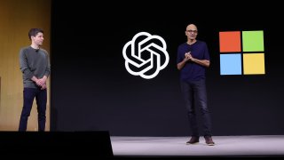 Microsoft CEO Satya Nadella, right, speaks as OpenAI CEO Sam Altman looks on during the OpenAI DevDay event in San Francisco on Nov. 6, 2023.