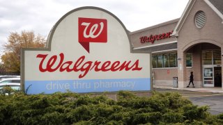 A sign sits in front of a Walgreens store on November 10, 2023 in Wheeling, Illinois. 