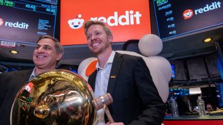 Reddit CEO Steve Huffman stands on the floor of the New York Stock Exchange (NYSE) after ringing a bell on the floor setting the share price at $47 in its initial public offering (IPO) on March 21, 2024 in New York City.