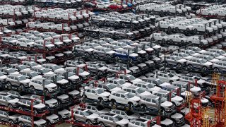 Aerial photograph shows electric cars for export stacked at the international container terminal of Taicang Port in Suzhou, in China’s eastern Jiangsu Province. The EU and China have reportedly agreed to start talks on the planned imposition of tariffs on Chinese-made EVs.