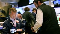 Traders work on the floor of the New York Stock Exchange during afternoon trading on October 03, 2024 in New York City.